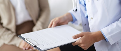 Physicians looking at a patient chart