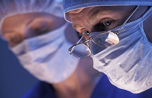 A surgeon in the middle of an operation